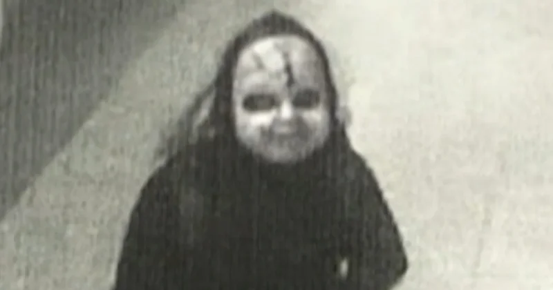 Man in Chucky-style mask chases woman, asks her if she's "ready to die"