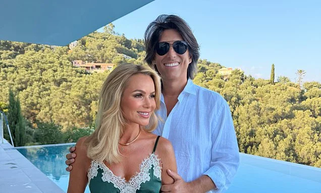 Amanda Holden, 55, showcases her radiant looks as she poses for a rare romantic snap with husband Chris Hughes