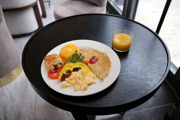 We have endured tiny glasses at hotel breakfasts for too long. Here is my proposed solution