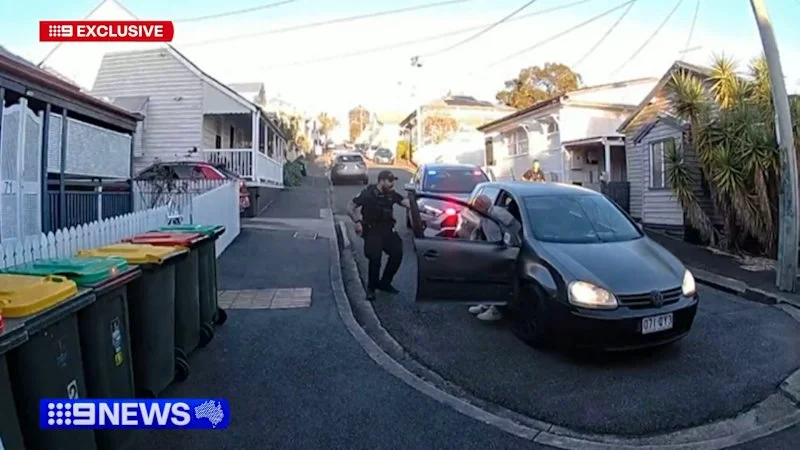 Driver arrested after allegedly ramming police car and crashing into house