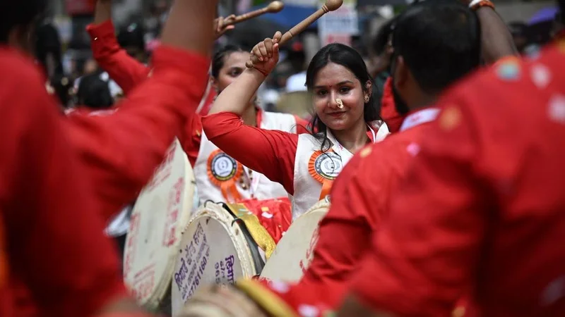 Pune’s Nashik Dhol team at Athachamayam rally in Kerala’s Thripunithura triggers row over alleged saffronisation