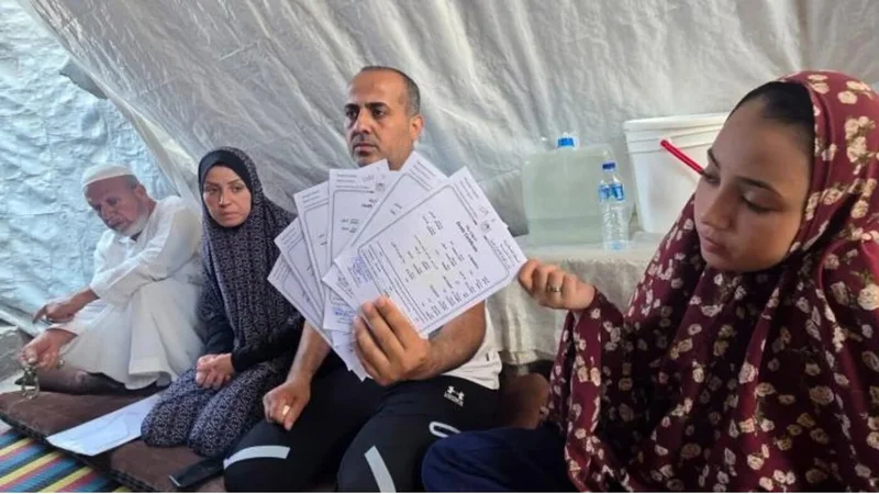 After three years apart, a Gaza father returns to his wife - and six death certificates