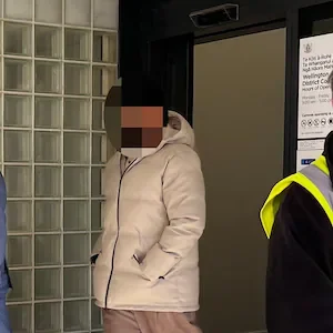 Why did prominent sports star on assault charge get to avoid media outside court?