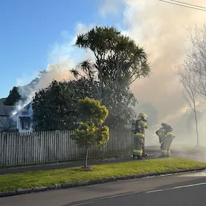Smoke drifts from Point England house fire as crews respond