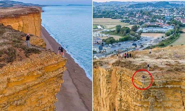 Teenage boy risks his life by posing for photo on edge of 150ft crumbling cliffs made famous by Broadchurch - despite safety warnings over massive rockfall