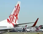 Sydney airport incident involving Virgin and Qantas flights didn’t have to be reported, Airservices Australia says