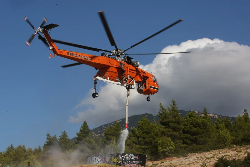 Two die as firefighting helicopters collide in Greece, French blaze changes course