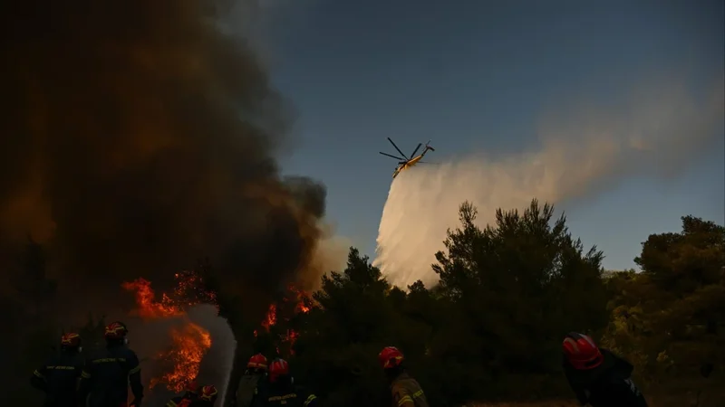 Greece firefighting helicopters collide as battle to contain wildfires continues