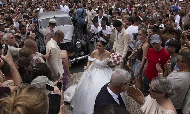 Ronald-NO! Thousands of CR7 fans mob bemused wedding couple wrongly believing they are the famous fotballer and his fiancee Georgina Rodriguez