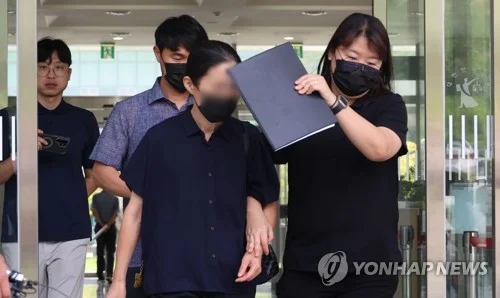 Court holds arrest warrant hearing for woman over fatal abuse of grandson