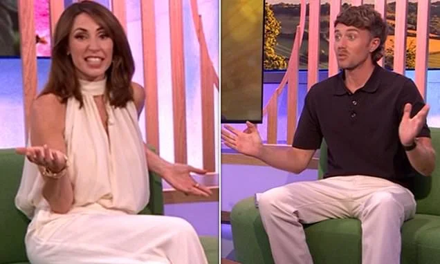 The One Show's Alex Jones and Roman Kemp are stunned as 20th anniversary special is interrupted by emergency wildfire phone alert with confused hosts mistaking it for a fire alarm