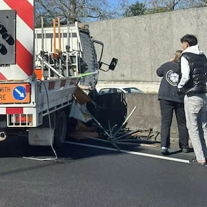 Truck crashes over median barrier on Auckland’s Northwestern Motorway