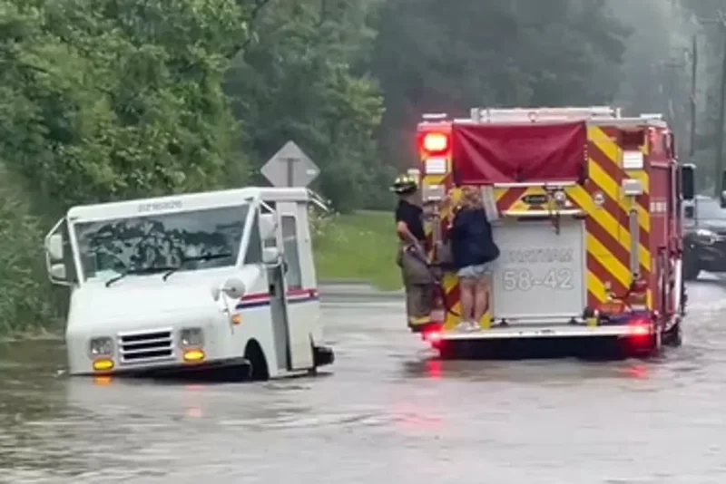 USPS driver rescued after mail van gets stranded in New York floodwaters