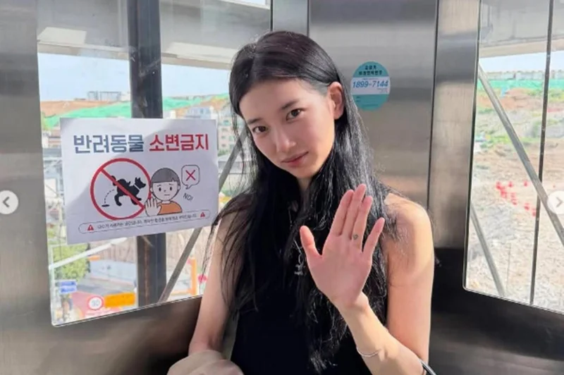 Suzy is already dressing for fall — even as summer heat lingers