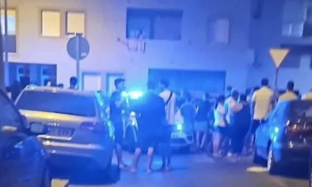 Pregnant woman and child among three dead as masked men open fire in drive-by shooting at Spanish holiday resort