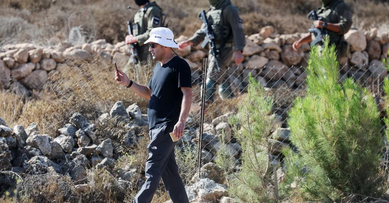Exclusive-Israeli settler confronts Palestinian American at his besieged West Bank home