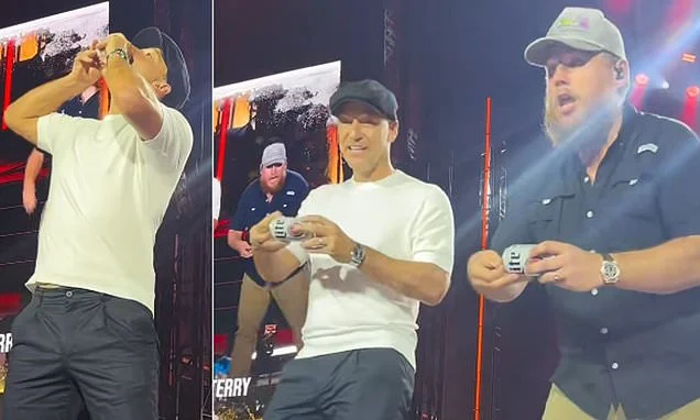 John Terry gets booed as he downs a pint on stage at Luke Combs' gig in London as fans say the surprise appearance was 'awkward'