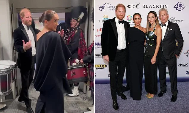 Meghan 'shapeshifts from childlike to confident' at event to support music mogul pal David Foster as she 'coyly' holds onto Harry in candid clip before switching to photo-ready 'regal mode', body language expert claims