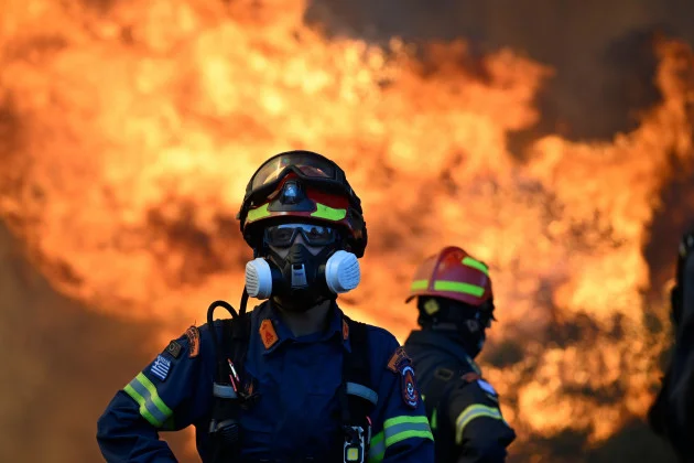 Two fire helicopters collide in Greece as forces battle multiple wildfires