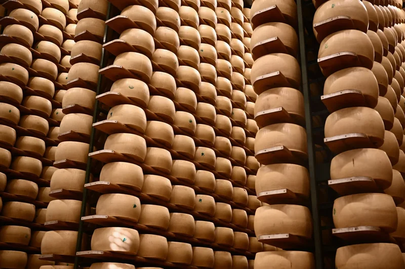 Italy’s $4.7 billion cheese economy is feeling the heat as climate change threatens its cheese banks that hold Parmigiano wheels as loan collateral