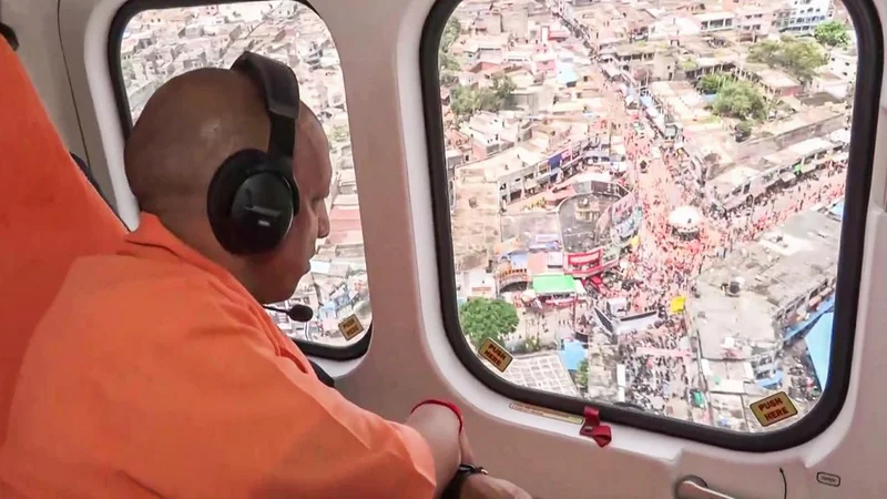 U.P. CM Yogi showers flowers on Kanwariyas, describes Kanwar Yatra as unparalleled example of devotion, unity