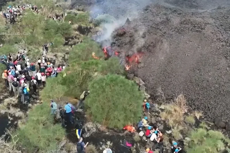 Hikers venture dangerously close to lava as Mount Etna erupts again