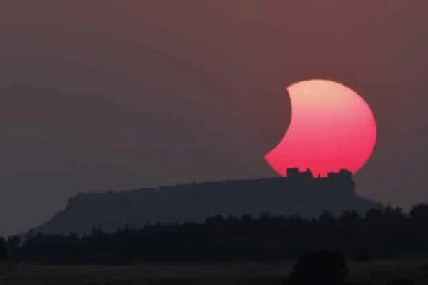 Spain darkens as solar eclipse races south from Arctic