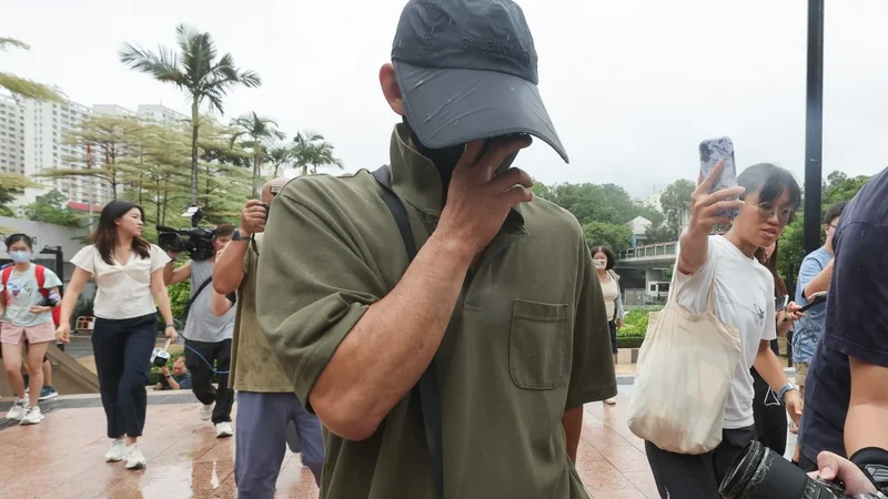 Hong Kong pet owner barred from leaving city pending trial over fatal dog attacks