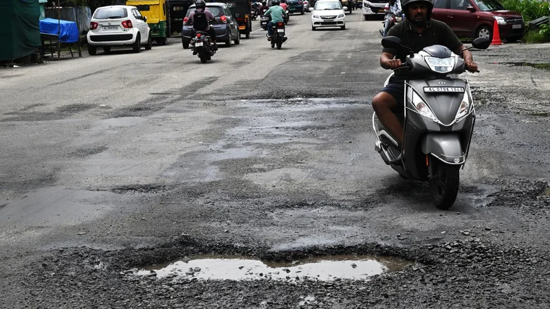 Monsoon lays bare Kochi’s battered roads as commuters bear the brunt