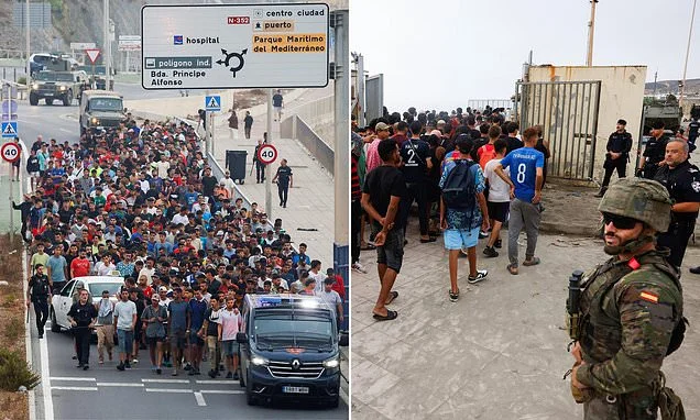 Dragged out of tunnels and frogmarched home: Astonishing moment thousands of migrants are escorted to the border by army as they take control in Ceuta