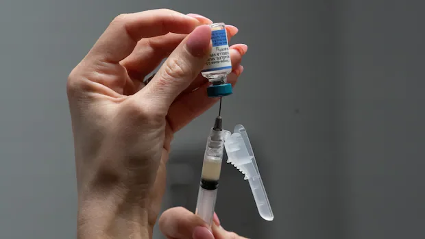 Trump signs executive order calling for fewer childhood vaccinations