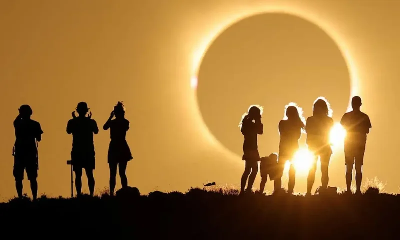 In pictures: Spectators watch in wonder as rare total solar eclipse plunges Spain into darkness