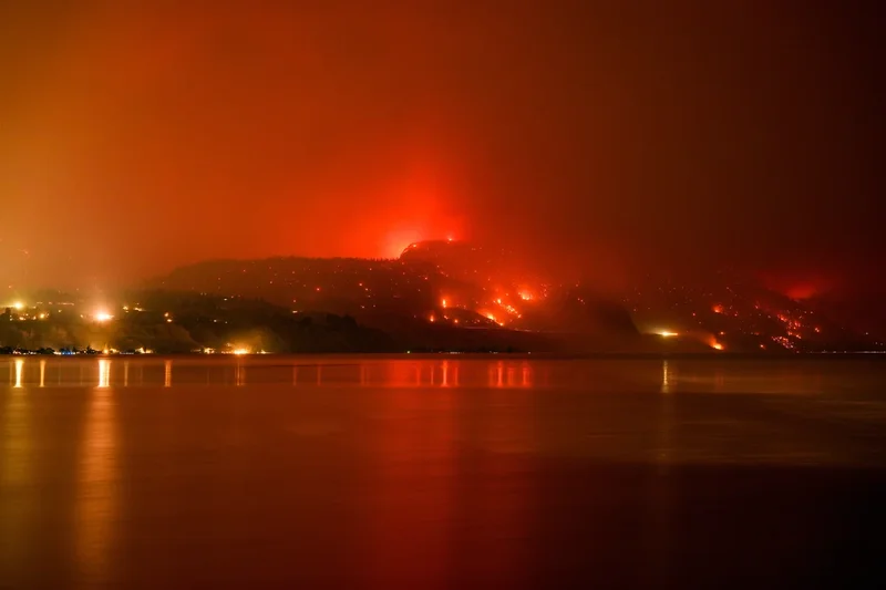 Thousands evacuated as wildfires burn across western US and Canada