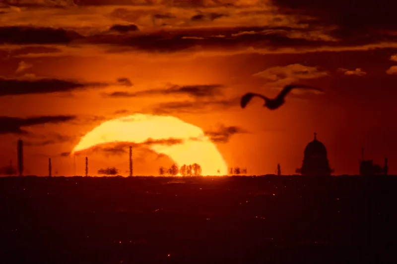 The best pictures as stargazers treated to astral delight with eclipse and meteor shower on same evening