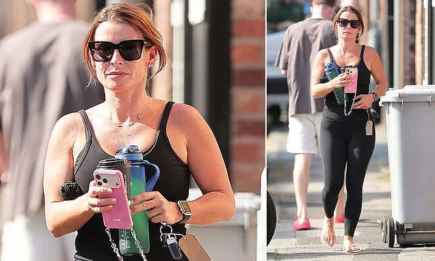 Coleen Rooney doesn't let 'extreme heat' warning get in the way of her daily workout as she heads to the gym as Britain faces one of its hottest days EVER