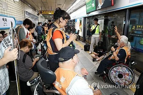 Disabled activists' protest temporarily disrupts Yongsan Station