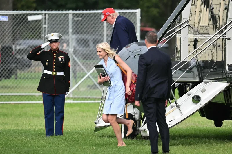 New photos show ‘Natalie Harp sprinting after Trump’s golf cart’ in 2023
