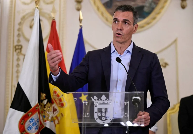 After weathering fires, Spain PM caught out by migrant crisis