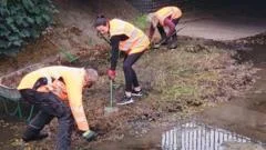 Volunteers clear brook to reduce flood risk