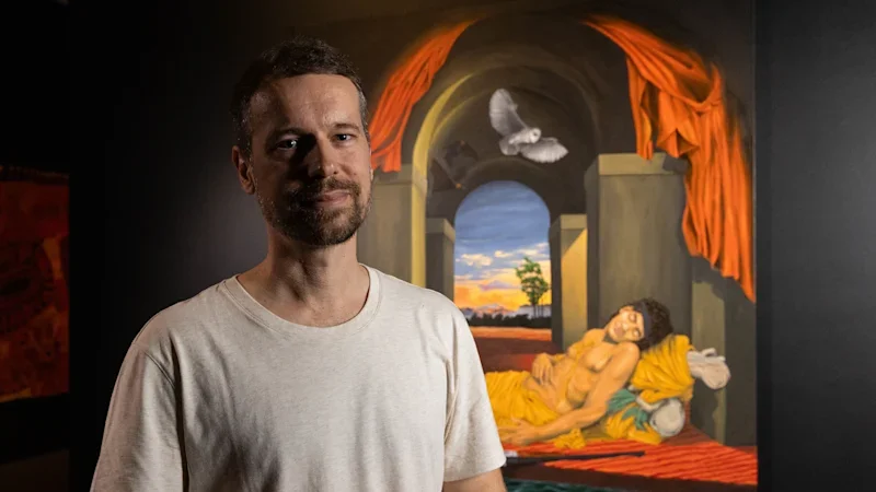A painting in which a man sleeps while the world burns has won a $100,000 art prize