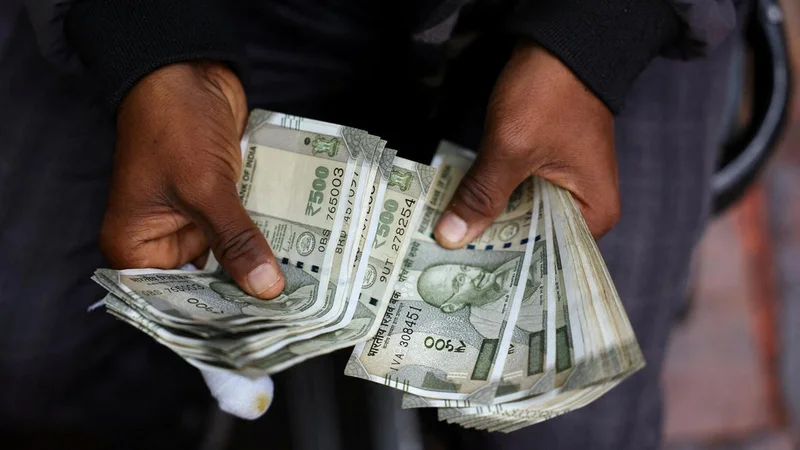 Rupee settles on flat note, higher by 3 paise at 95.70 against U.S. dollar