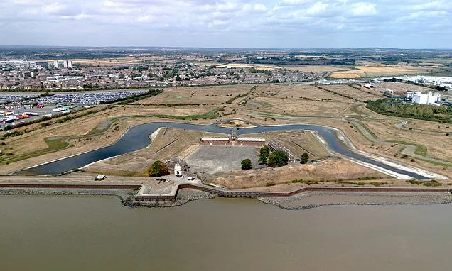 Britain finally gets rain...but it's not enough to reverse drought: Parts of UK hit by showers but reservoirs still run dry as car washes and swimming pools brace for water bans