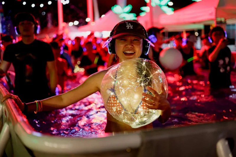 South Koreans beat the heat with ‘silent disco’ pool party