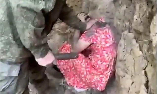 Russian soldier is made to wear a dress and told he'll be made to wear it in 'meat-grinder' as punishment for deserting post