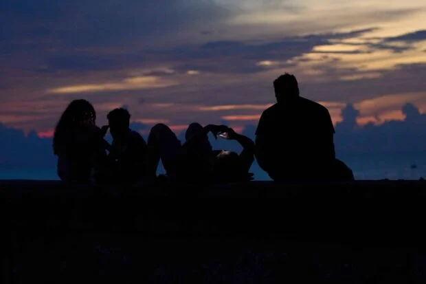 Cubans seek relief from blackouts, heat on seaside boardwalk