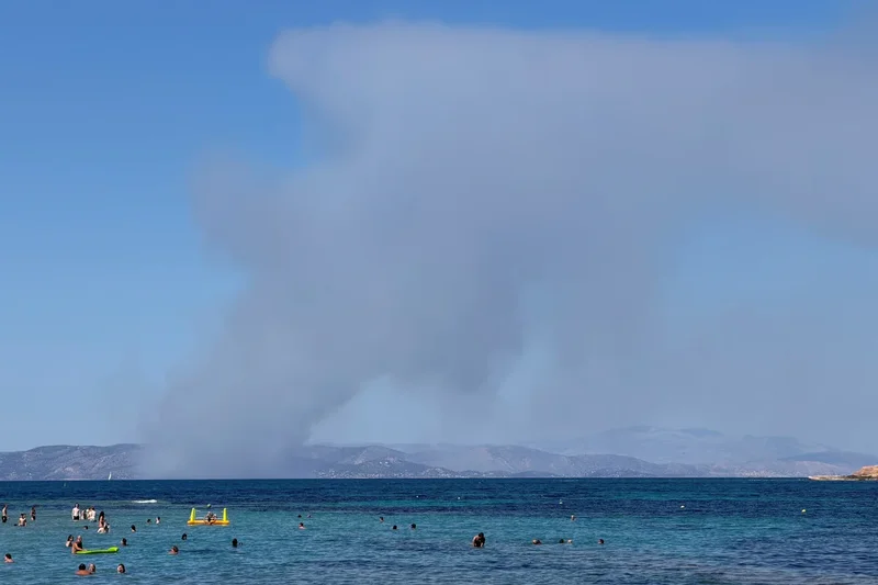 Two dead as fast-moving wildfires sweep Greek island of Salamina with residents preparing to evacuate