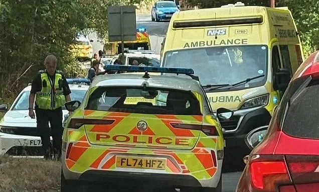 Man, 55, dies after being bitten by dog on footpath - as police arrest its owner on suspicion of murder