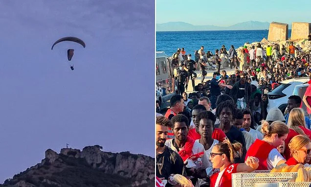 Migrants PARAGLIDE into Ceuta - with one killed after crashing into the sea - amid fears another 'invasion' has been planned