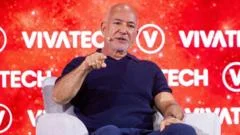 Bezos-backed consortium buys a third of Liverpool